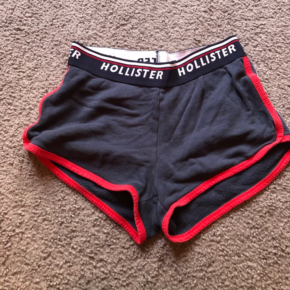 navy hollister shorts with a red & a white stripe